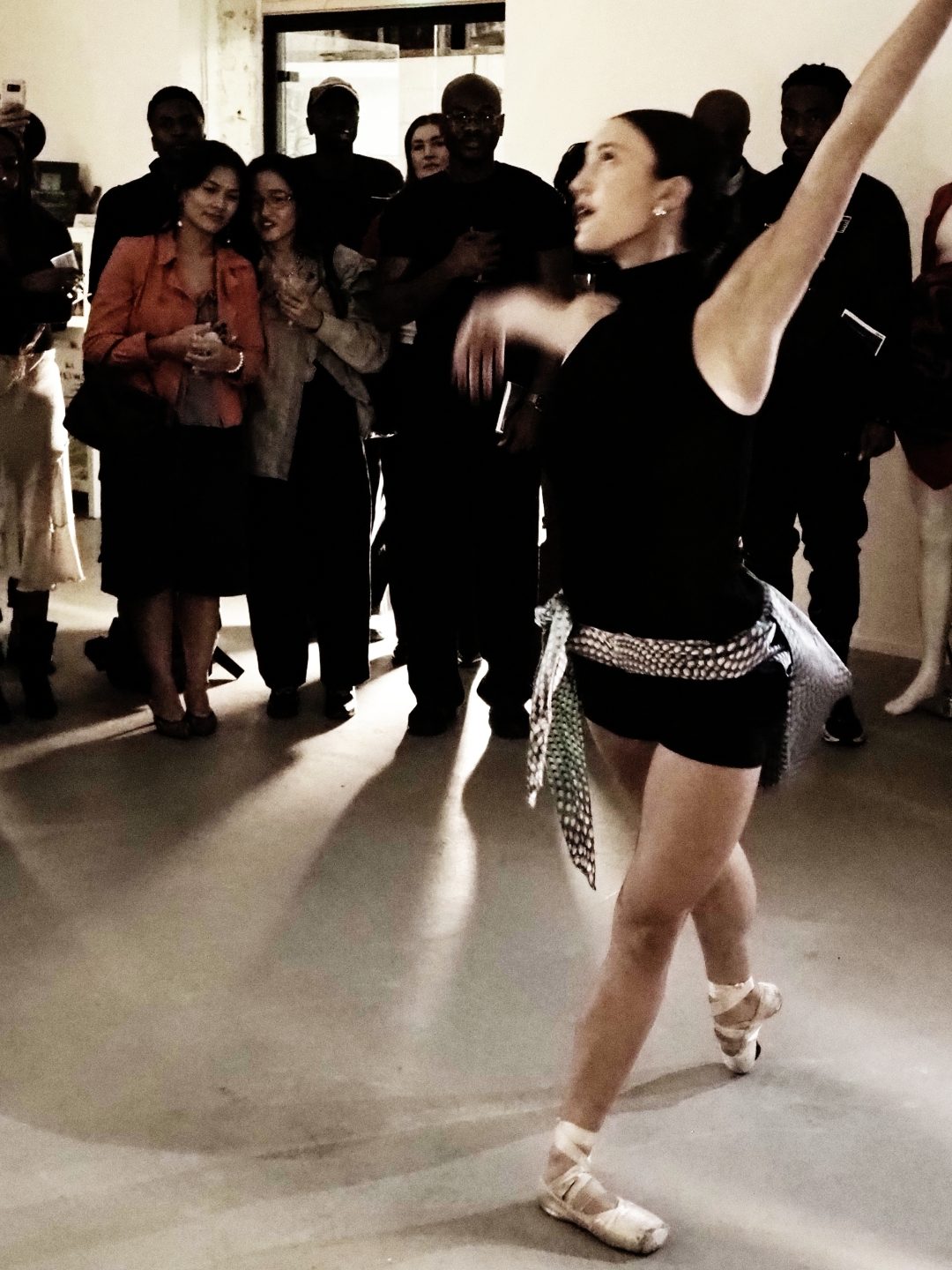 A dancer performing at the Fluidity exhibition launch party