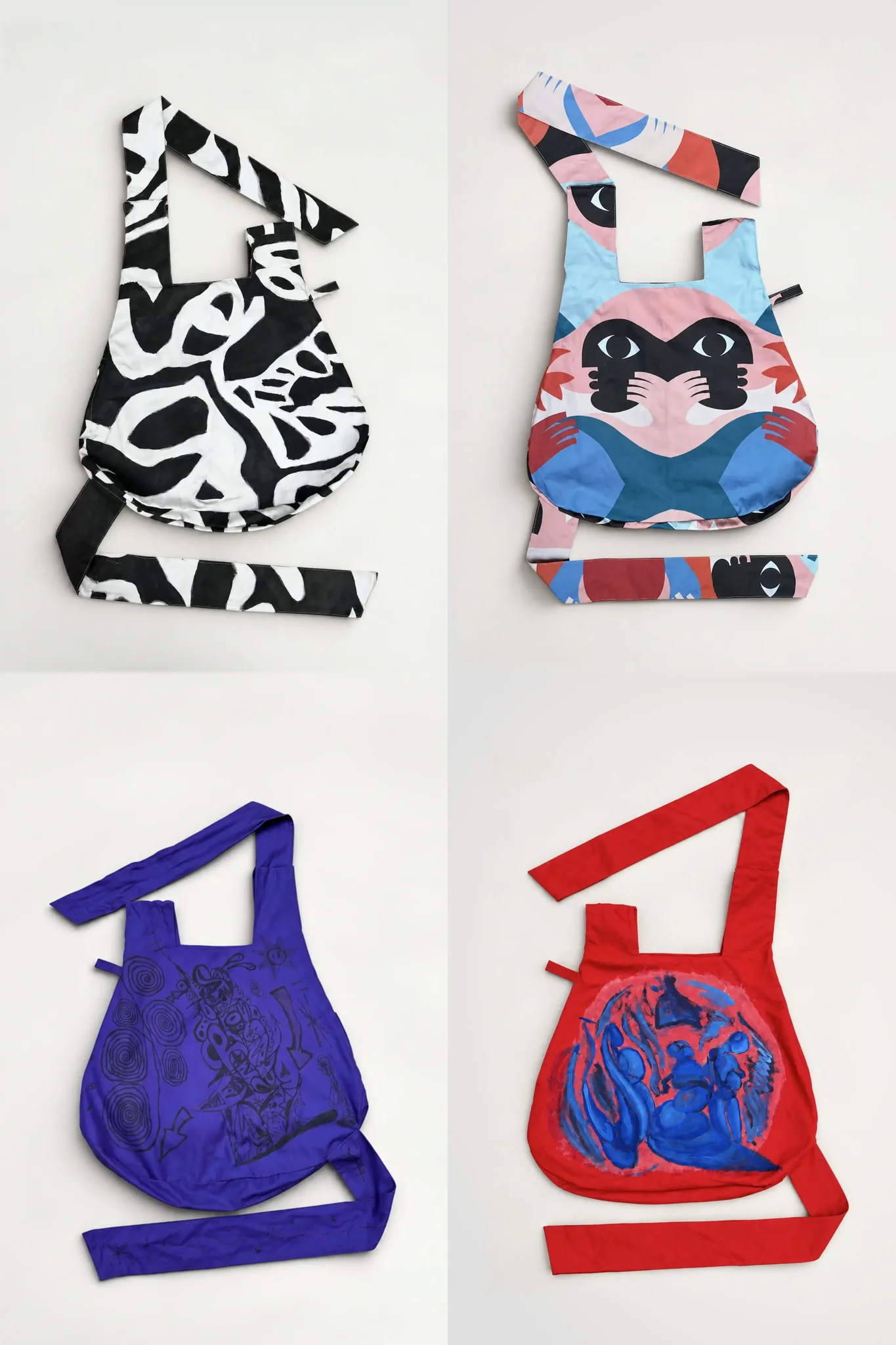 Four Artist Collaboration iYOBA(G) bags: black and white pattern, pink and blue faces, purple drawings, red with blue figures
